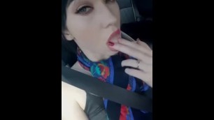 Sexy girl in car fingering herself