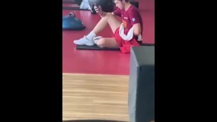 Young man masturbating at the gym