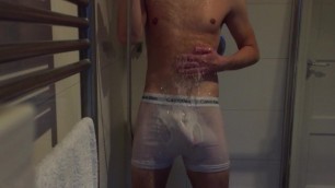 Showering with hard cock in white underwear