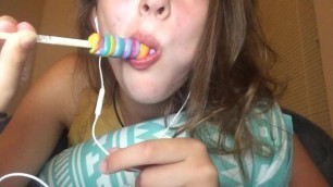 Teen eating lollipop