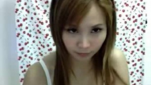 Lovely asian teen is showing her hairy pussy on webcam